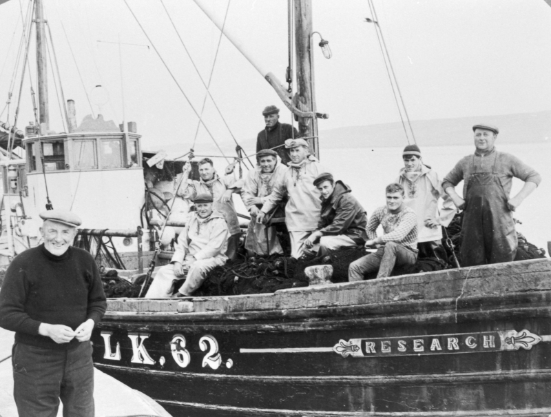Crew of 'research' LK62 on last day of fishing. Skipper Robert Polson on pier.