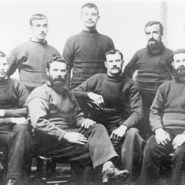 Studio portrait of the crew of 'Agenora', KY534. Buckhaven, 1895. Back row, L-R: James Thomson, James Taylor, WIlliam Thomson Front row, L-R: James Gordon, Thomas Thomson, Walter Foster, Robert Thomson. Robert Thomson was the owner of 'Agenora' and WIlliam Thomson was son of Andrew Thomson and father of Thomas 'Piper' Thomson.