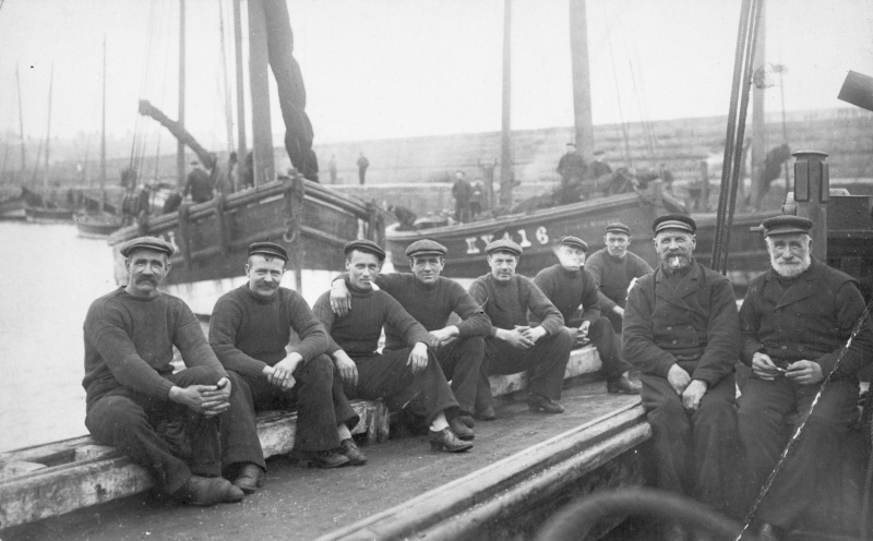 Crew of 'Guide Me', KY301. Taken in Port Dover, Canada, 1906. 'Jessie Hughes', KY416, can be seen in the background. L-R: William Davidson (known in Port Dover as Scotty Bill), Robert Davidson, John Wood, Richard Davidson, Alex Brown, Robert Muir, Alex Muir, Alex Watson, and Captain Robert Davidson