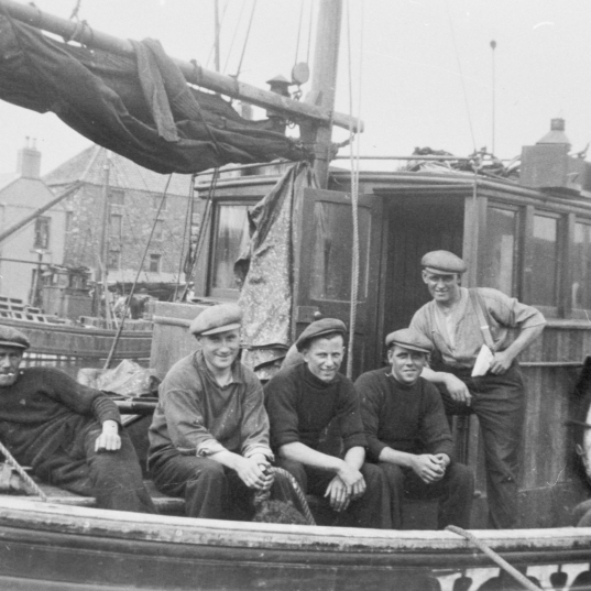 Crew on board 'Star of Hope', KY119. Taken at Eyemouth, 1939. L-R: Peter Boyter, David W. Allan, J. Stevenson, Tom Costorphine, David Costorphine, and Jock Brown. Skipper Tom Ovenstone is not present.