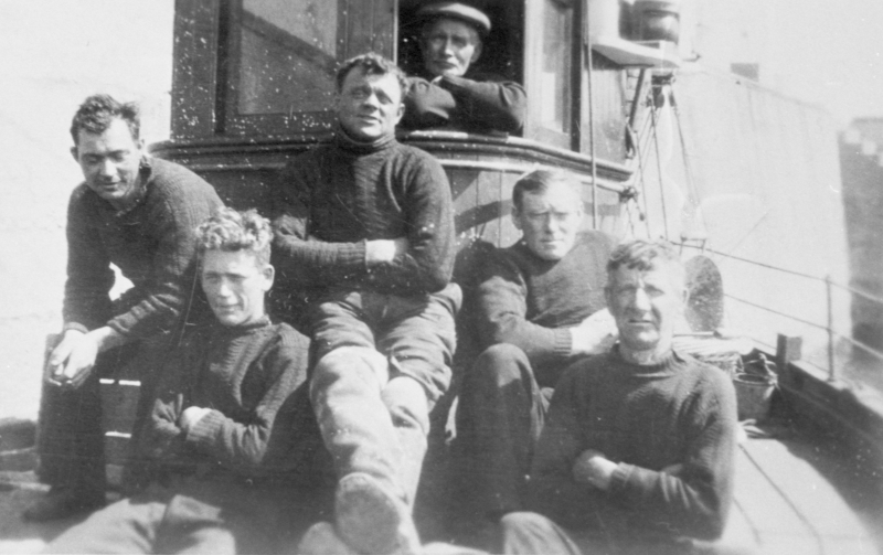 Crew of drifter, 'Just Reward', KY239. Skipper D. Costorphine is second right. It is believed that Thomas Anderson is pictured second from the left. He was lost at sea 1.5 miles from May Island when he is believed to have falled overboard. He was 27. Original - A. Anderson, Roger St, Cellardyke.